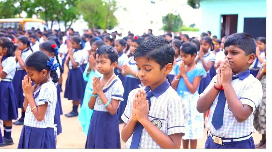 Children at morning prayer on the school ground